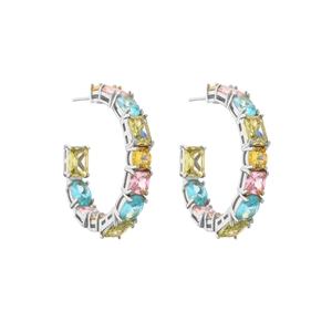 Macro detail of C-shaped silver earrings with multicolor cubic zirconia stones