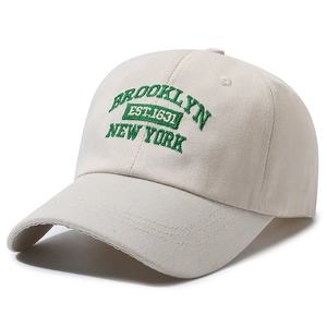 Classic beige cotton baseball cap with green Brooklyn embroidery in 45-degree view