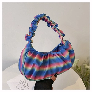Detail of the rainbow gradient pleated shoulder bag showing soft satin texture and colors
