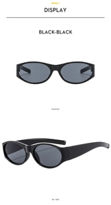Front and 45-degree angle view of vintage black oval sunglasses with glossy frames