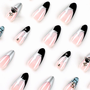 French tip press-on nails with silver glitter stars and Saturn rhinestone charms