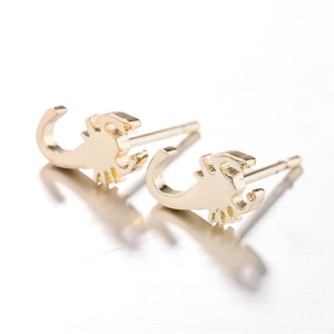 Detailed close-up of gold-plated scorpion stud earrings on a high-gloss white background