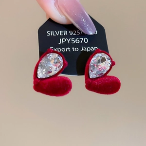 Detail of red velvet heart earrings with pear-cut rhinestone and 925 silver posts