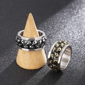 Punk style rotating skull stainless steel rings in silver and gold finishes for men