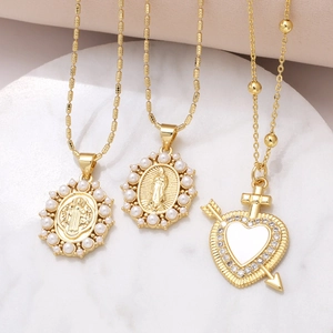 Vintage gold necklaces with heart cross and Virgin Mary pendants featuring pearls and zircons