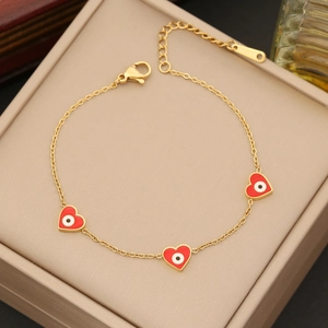 Golden stainless steel chain bracelet with red heart charms and evil eye enamel patterns