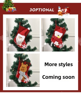 Close-up of Christmas stockings with Santa, Snowman and Reindeer cartoon embroidery