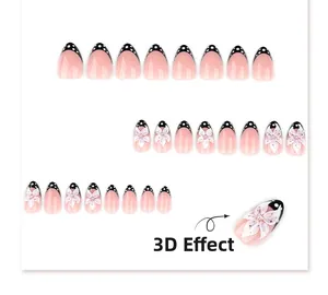Détail de 23 faux ongles French noirs avec fleurs en résine 3D et strass brillants