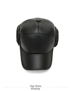 Top view of premium black faux leather flat cap with warm plush ear flaps for winter