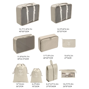 Beige 9-piece travel storage set with sizes in CM and inches for organized packing