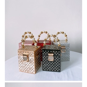 Group display of acrylic box evening bags with rhinestones and pearl handles