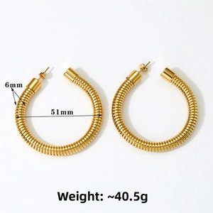 Close-up of gold stainless steel hoop earrings with unique 51mm spiral snake texture