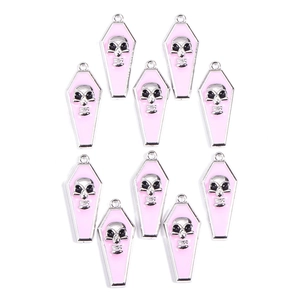 Detailed view of ten pink enamel coffin pendants with silver skulls for DIY jewelry making