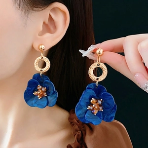 Vintage floral drop earrings with gold metal rings and marble texture blue petals