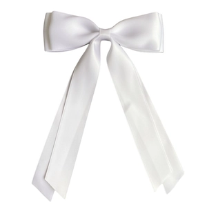 Detail of a large white double-layered satin ribbon bow hair clip with long streamers