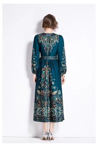 Rear view of long sleeve paisley print dress with waist tie and A-line silhouette