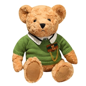 Caramel teddy bear plush in green knit sweater with gold Teddy foot embroidery