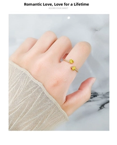 Detailed view of adjustable gold-plated ring with dual yellow heart-shaped zircon stones