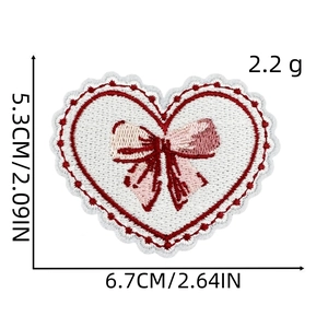 Detail of heart embroidery patch with pink bow and dimensions of 6.7cm by 5.3cm