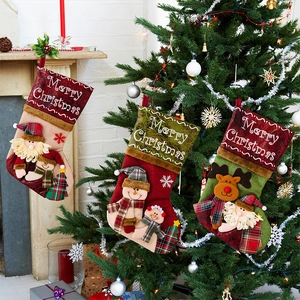 Three festive Christmas stockings with Santa, Snowman and Reindeer 3D character dolls