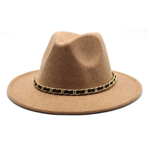 Detail of camel wool fedora hat featuring a vintage gold chain and leather decorative band