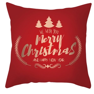 Red Christmas pillow cover with golden Merry Christmas text and reindeer motifs