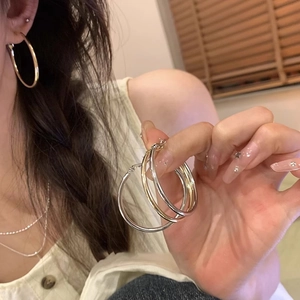Minimalist large high-polished metal hoop earrings in gold and silver finish for women