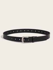 Detail of black belt with heart-shaped cutouts and sparkling rhinestone buckle