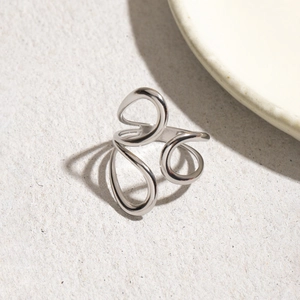 Minimalist silver stainless steel open ring featuring a geometric curved line design