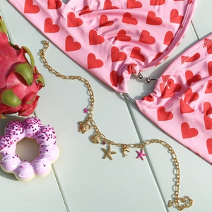 Gold ocean charms chain with starfish and dolphin pendants on beach bikini set