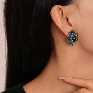 Vintage floral stud earrings with deep blue crystals and retro palace style design
