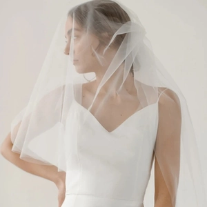 Minimalist white bridal veil with elegant double-layer tulle design for lawn weddings