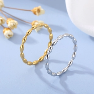 Minimalist stainless steel beaded rings in gold and silver with chain texture
