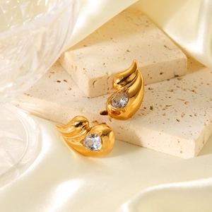 Detail of double teardrop stainless steel earrings with large pear-cut zircon crystals
