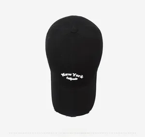 Close-up of vintage distressed black cotton baseball cap with white New York embroidery