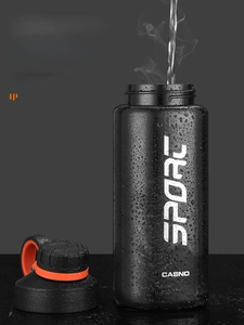 Detailed view of durable black sports bottle with water droplets and steam effects