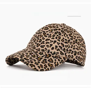 Detail of khaki corduroy baseball cap featuring small leopard print and textured fabric