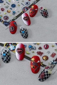 Detail of 5D embossed nail stickers featuring astronauts, planets, and red checkered patterns
