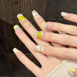 Pink and yellow bow accent press-on nails with 3D blue ribbon and plaid patterns