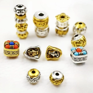 Tibetan silver cylinder spacer beads with mantra and skull carvings for jewelry making