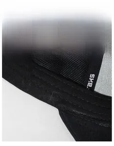 Detail view of the black baseball cap featuring a wide moisture-wicking sweatband and BXS logo