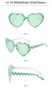 Macro detail of heart-shaped sunglasses in green checkerboard pattern with C.18 label