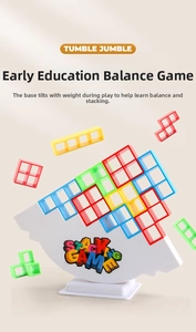 Macro detail of balancing block stacking game with colorful blocks and a white rocking base