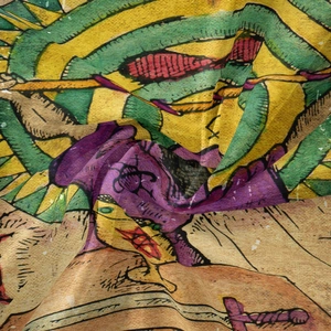Macro shot of bohemian tapestry fabric showing vintage illustration and weaving texture