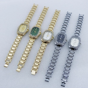 Detail view of five luxury quartz watches with rhinestone bezels and oval dials