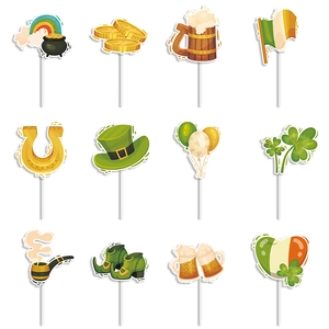 Macro shot of 12 distinct St. Patrick's Day cartoon cupcake toppers on white background