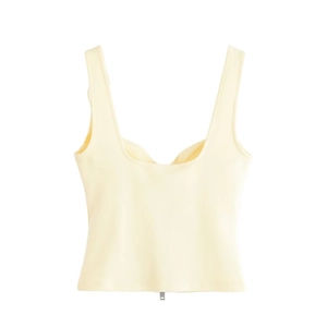 Women's light yellow two-piece set featuring a cropped vest top with metal zipper detail