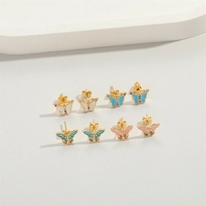 Vintage gold butterfly stud earrings with colorful enamel and gemstones set in four colors