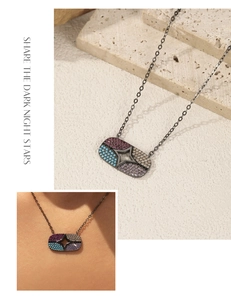 Close-up of S925 sterling silver star necklace with colorful micro-set gemstones