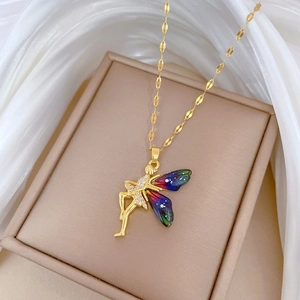 Macro detail of fairy wing pendant with colorful crystals on a gold chain necklace